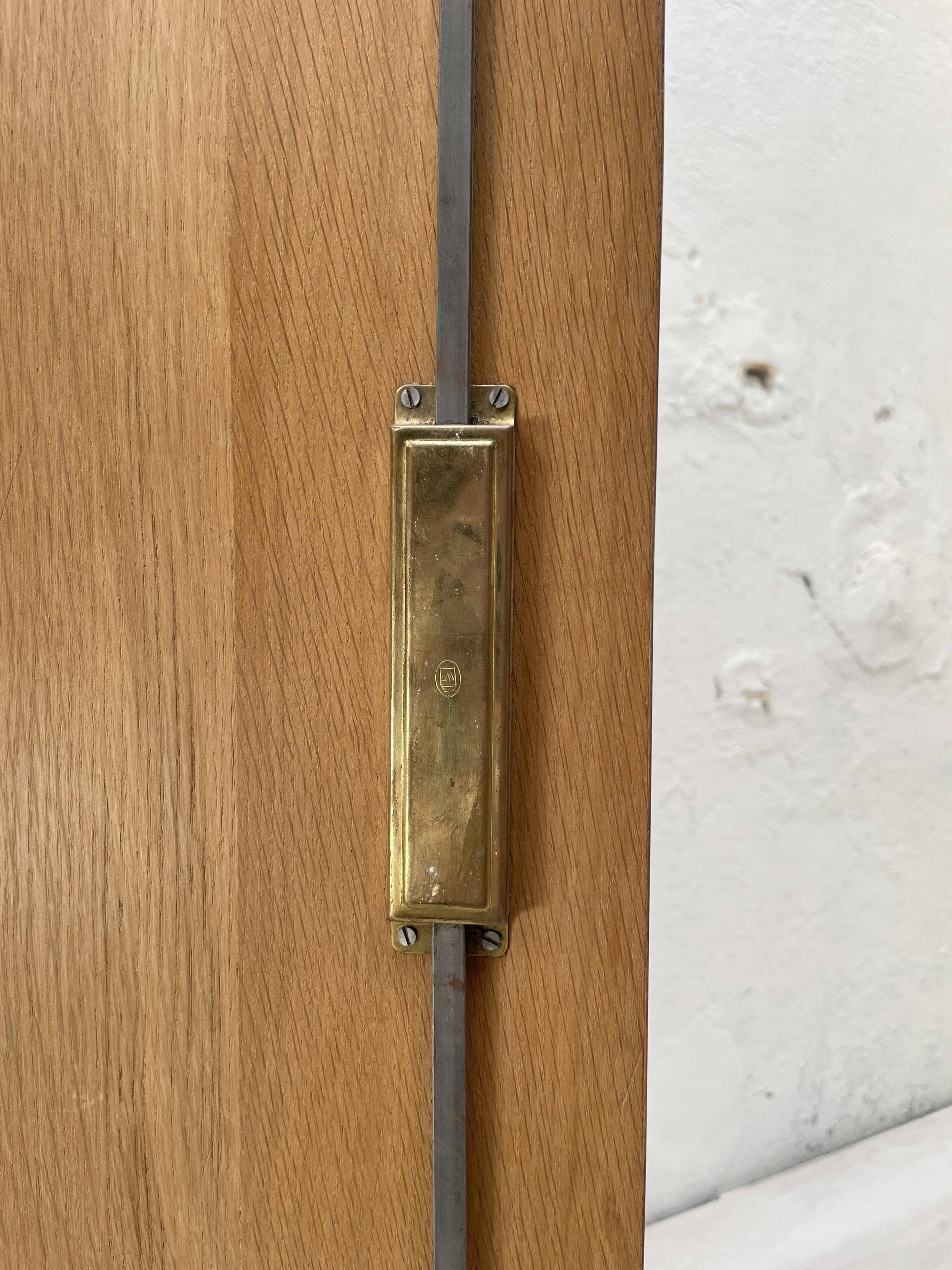Storage unit in solid oak and veneer, circa 1960.