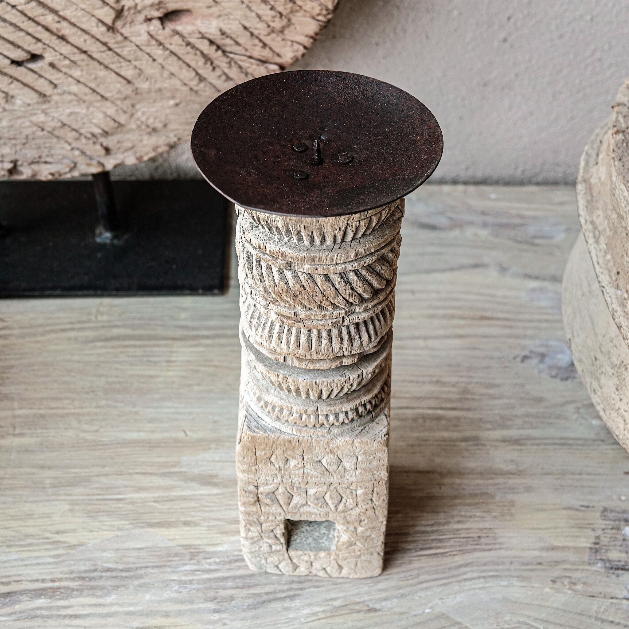 Candle holder in light carved wood