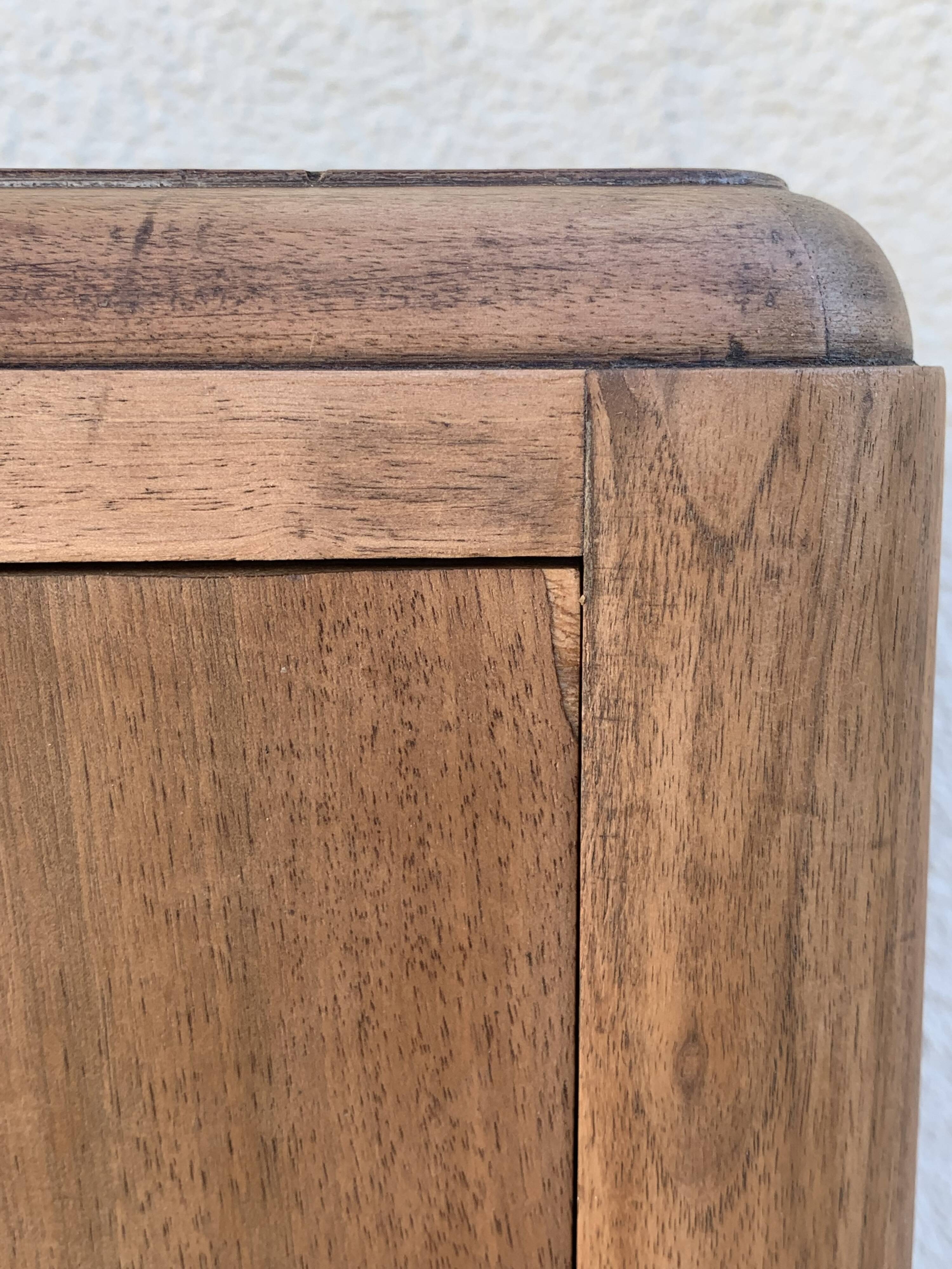 High art deco chest of drawers with mustache feet in raw walnut, 1930s