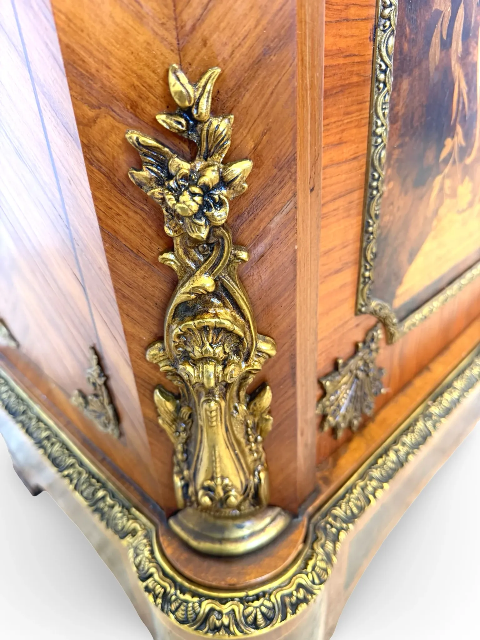 An antique French Louis XVI-style marble-top side cabinet