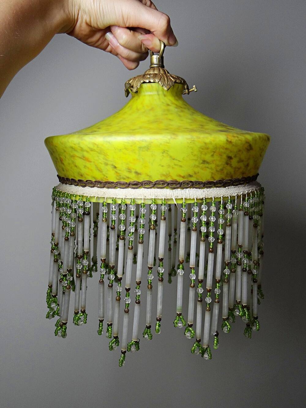 Antique Art Deco lampshade in yellow marbled glass with bead fringes.