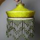 Antique Art Deco lampshade in yellow marbled glass with bead fringes.