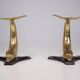 Solid brass dolphin console feet.