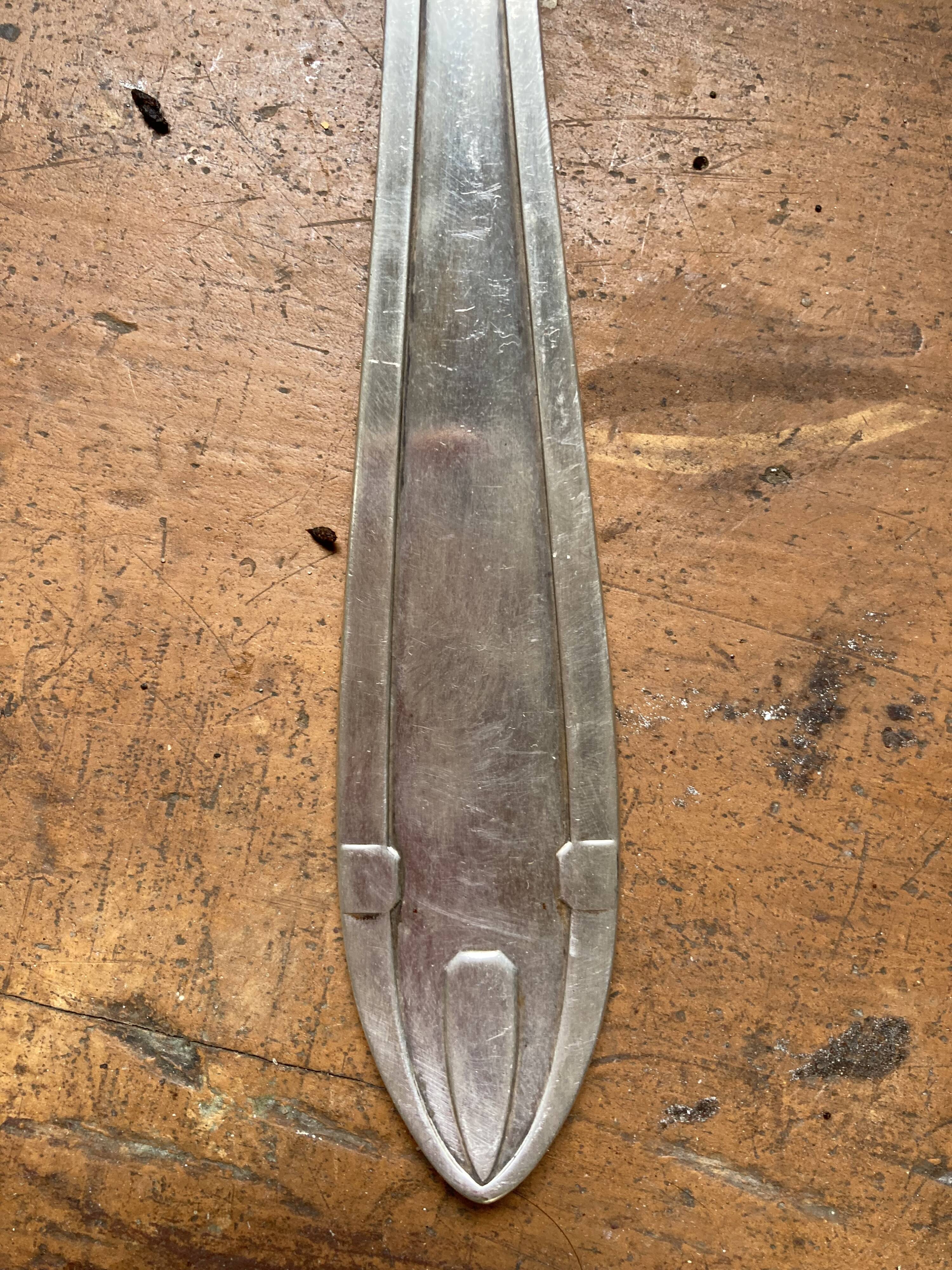 Old art deco ladle in silver metal Dixi