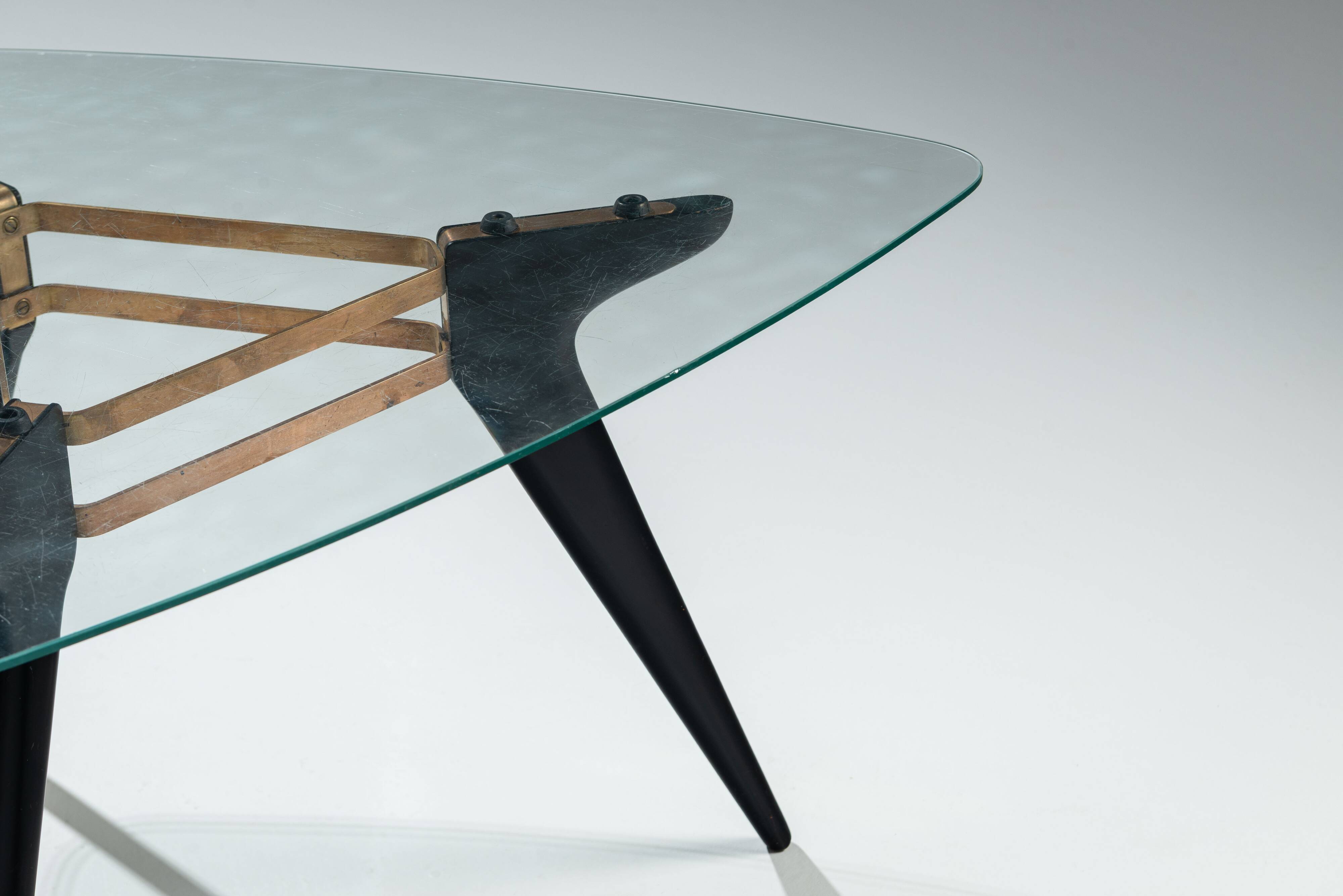 Triangular coffee table in the manner of Alfred Hendrickx