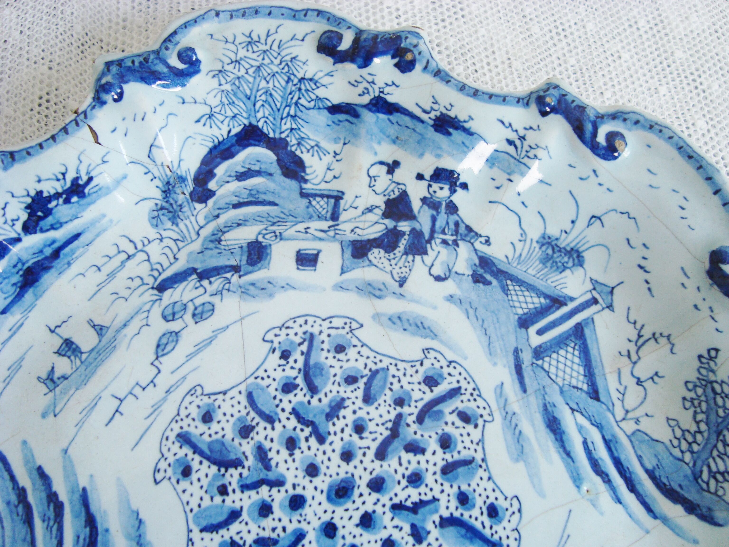 Old blue and white Delft decorative plate with Chinese motifs