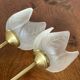Pair of tulip-shaped candle holders in frosted glass and brass.