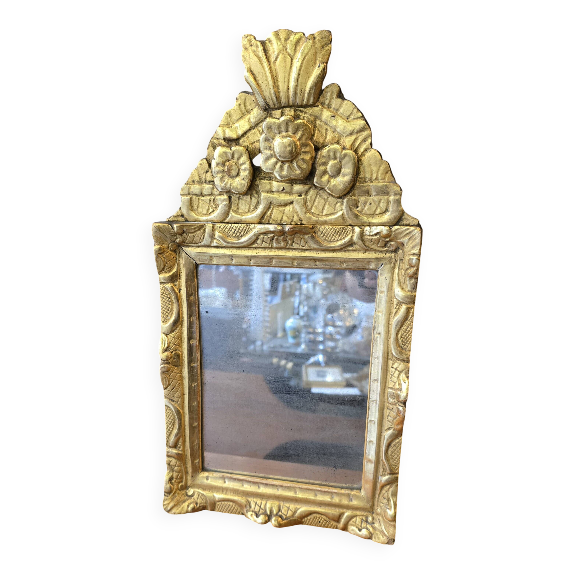 Small Louis XIV mirror in gilded carved wood from the early 18th century.