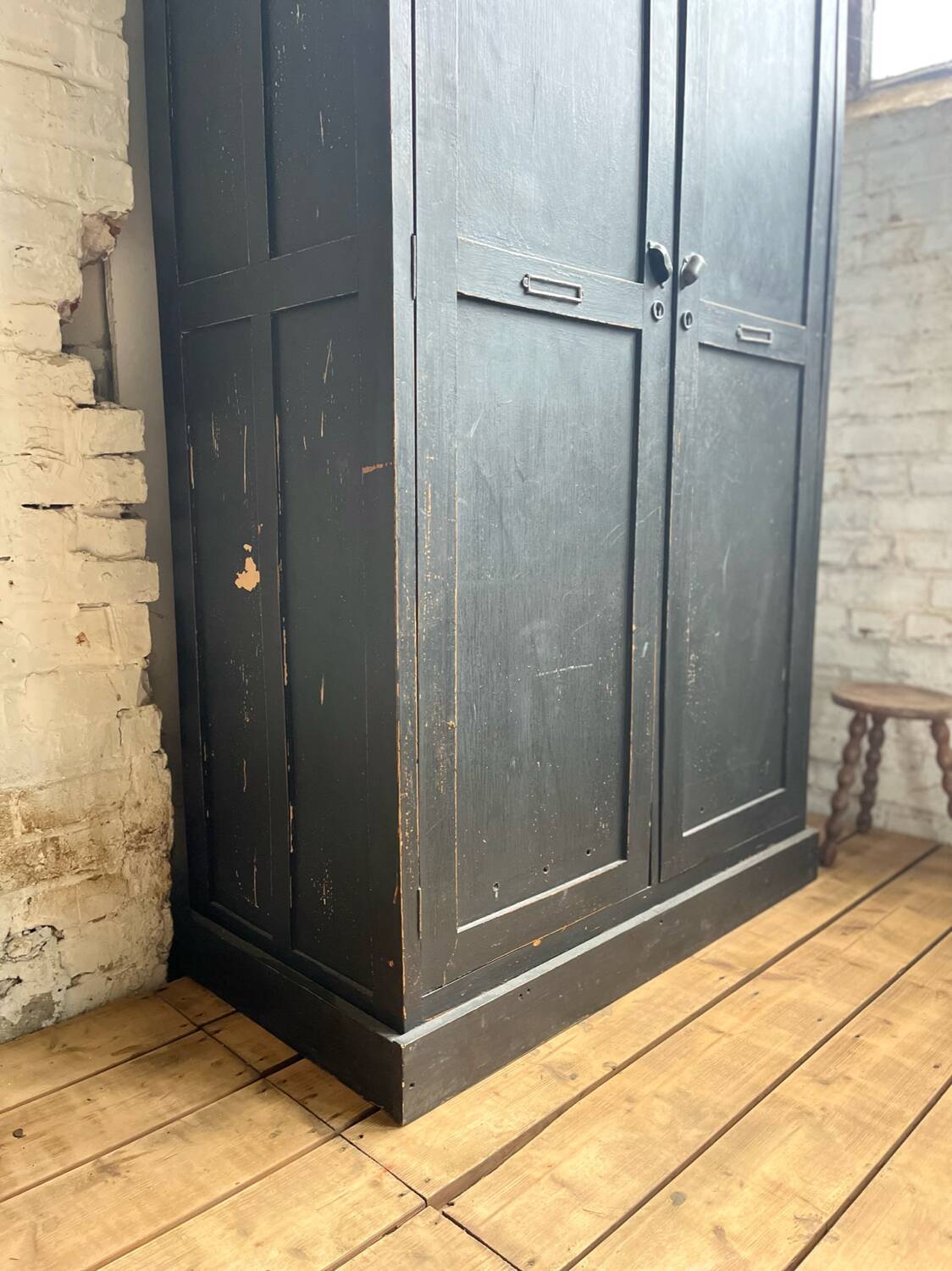 Old wooden locker with black patina