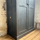 Old wooden locker with black patina