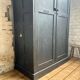 Old wooden locker with black patina