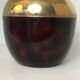 Apple-shaped ice bucket in red celluloid, gold-tone metal and plastic