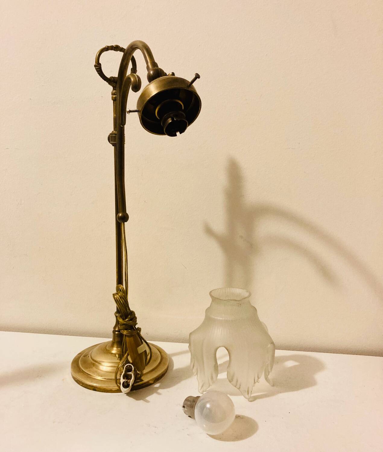 Brass table lamp with a glass shade