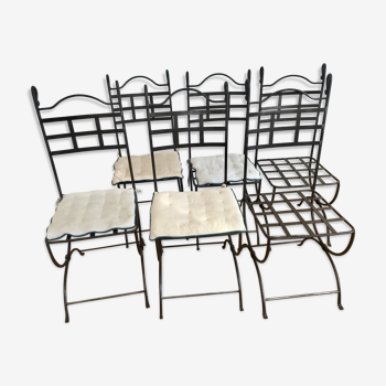 Six wrought iron chairs