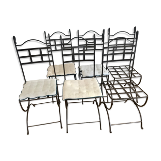 Six wrought iron chairs