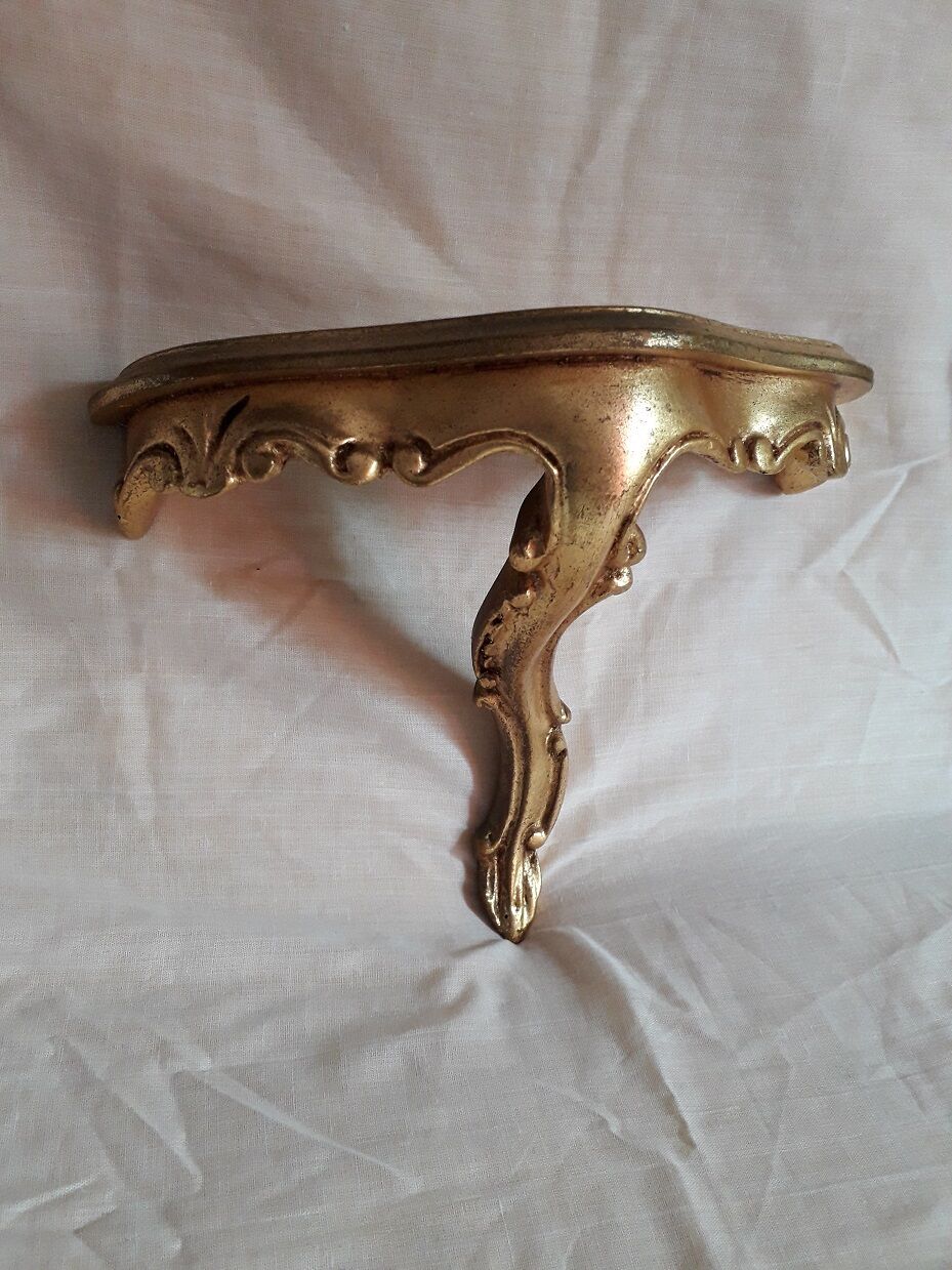 2 small golden wall shelves