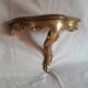 2 small golden wall shelves