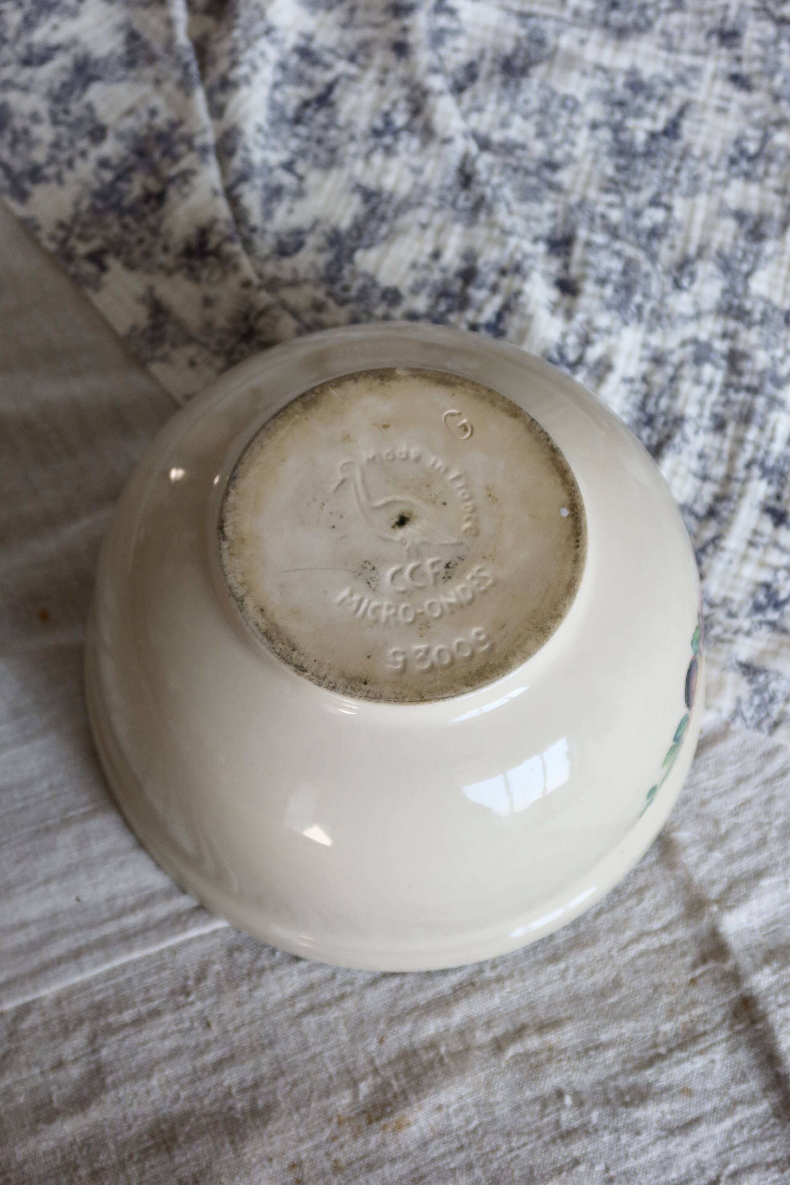 Vintage round earthenware salad bowl with fruit pattern