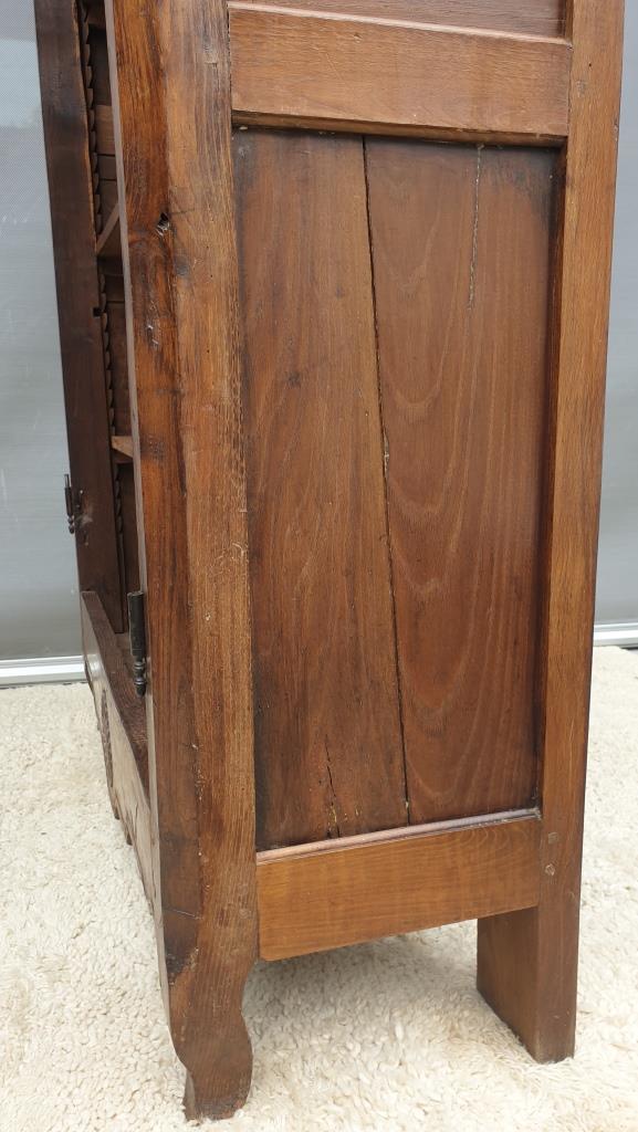 Walnut glazed bookcase with nineteenth century rose window