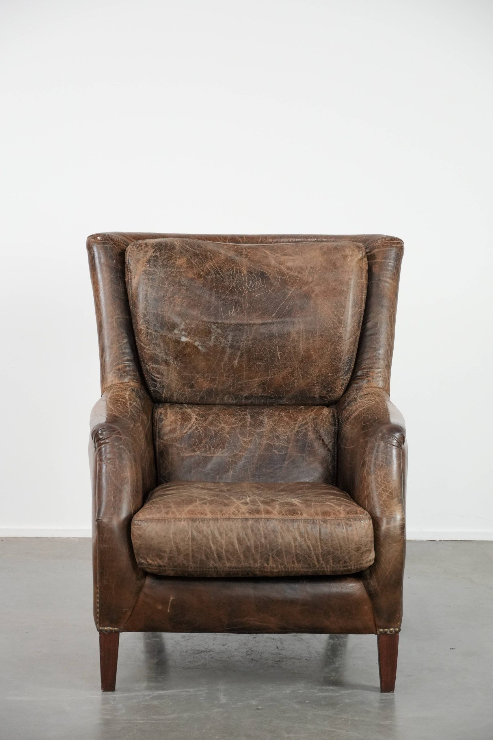 Very comfortable vintage cow leather armchair with character