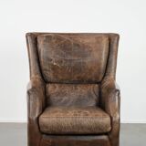 Very comfortable vintage cow leather armchair with character