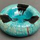 Twentieth century ceramic ashtray decorated with animals on a blue background