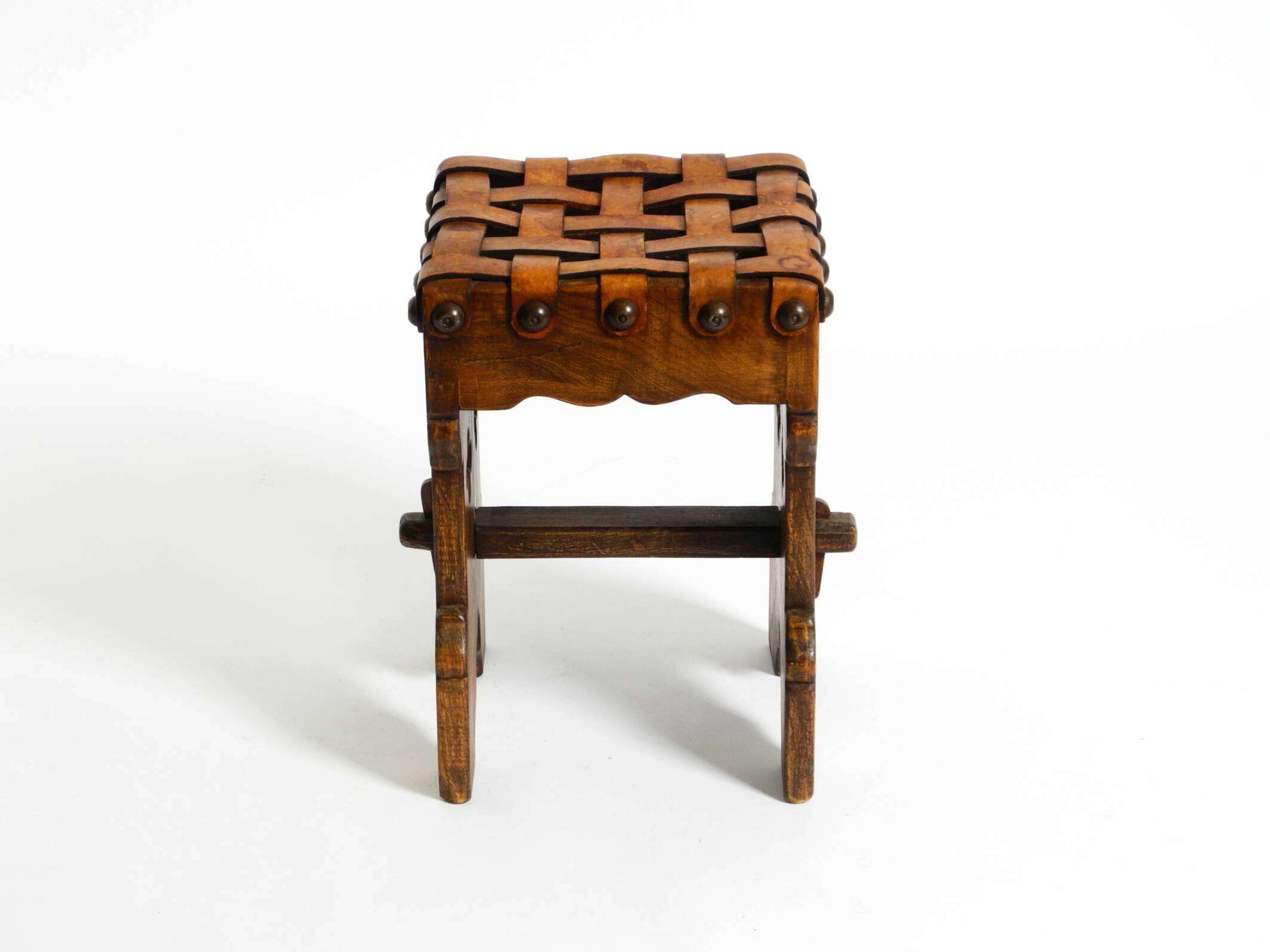 Beautiful 1940s oak stool with a seat made of leather straps