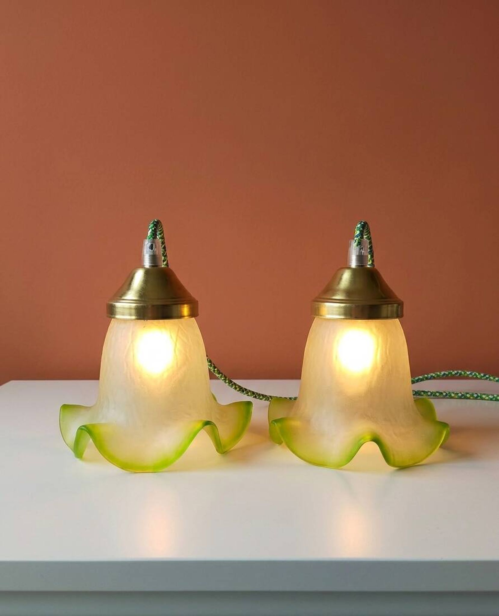 Duo of portable lamps in green tulip design.
