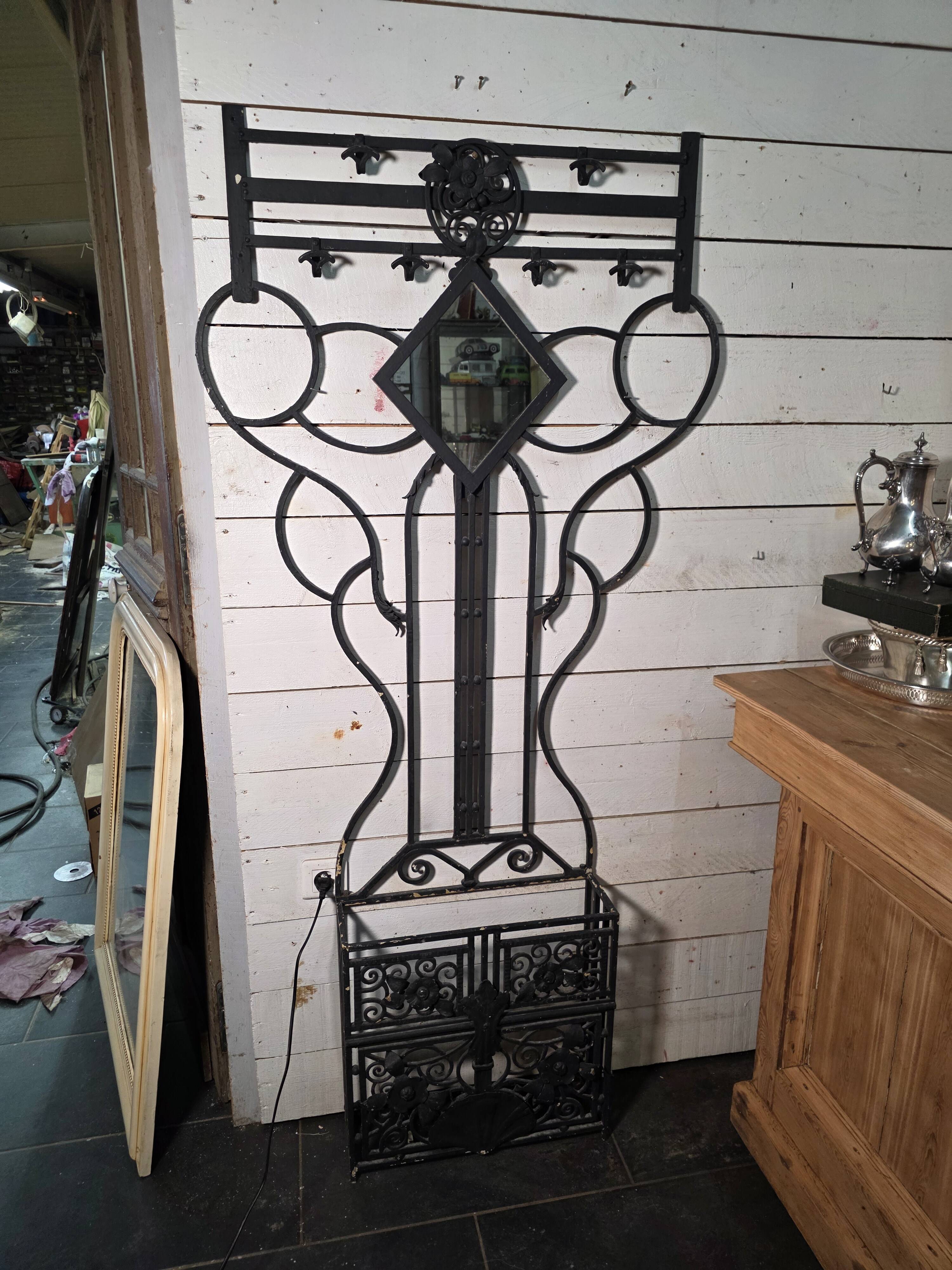 Art Deco coat rack wardrobe in wrought iron from the 1930s.