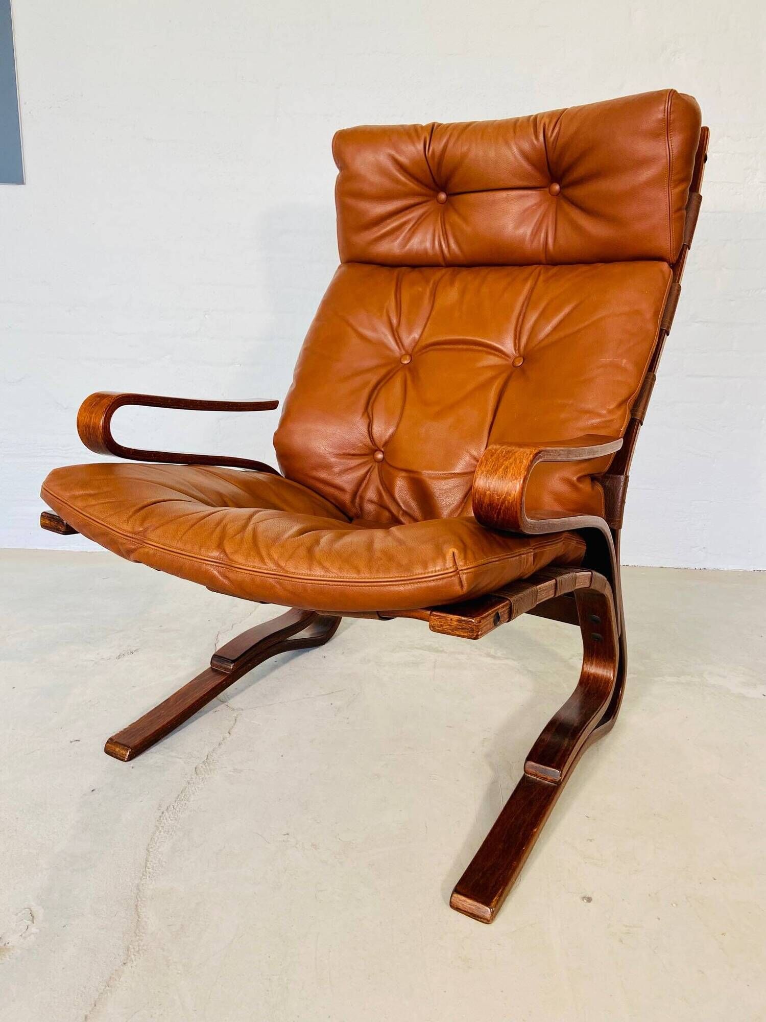 Vintage scandinavian cognac lounge chair by oddvin rykken 1960s
