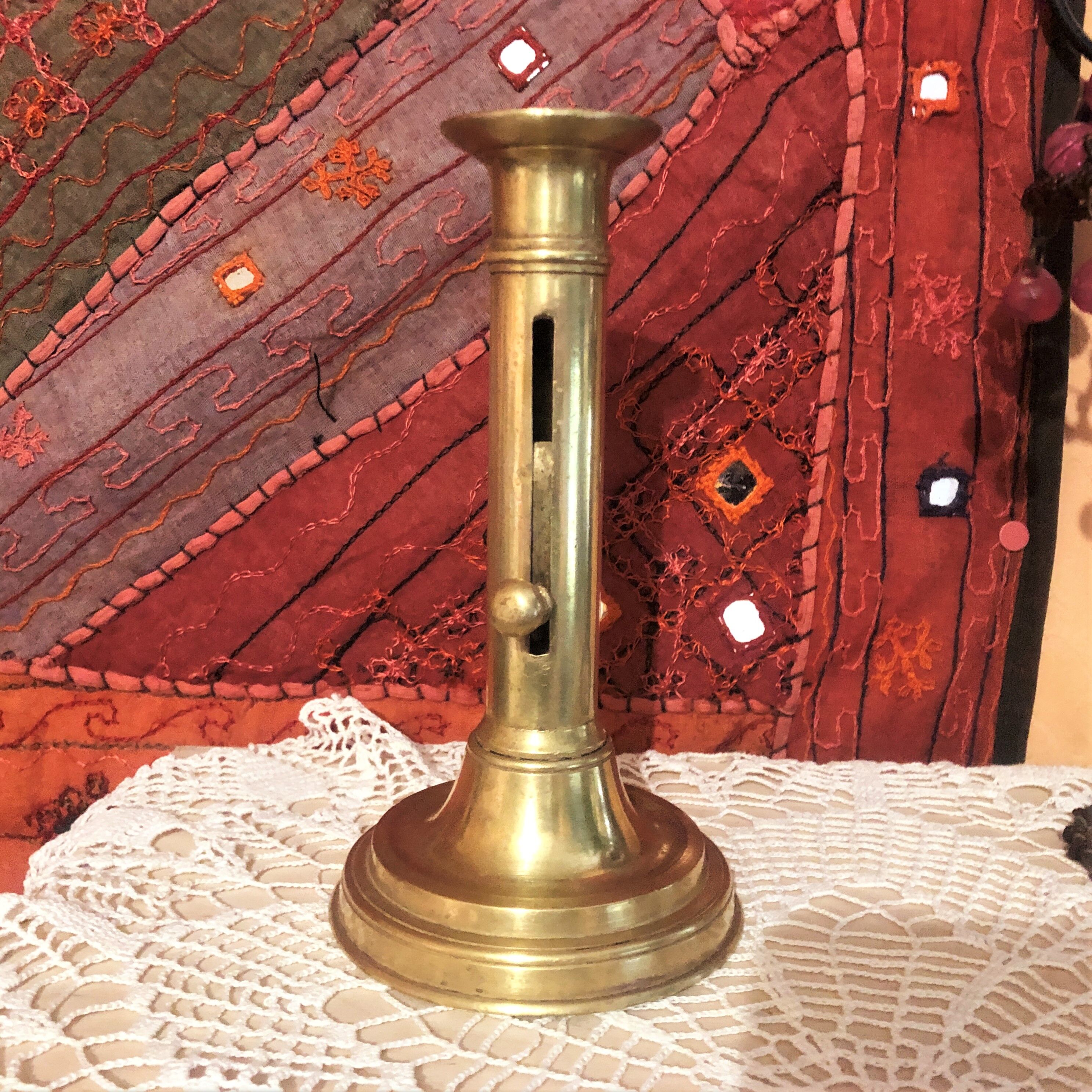 Old gold copper candle holder with pusher