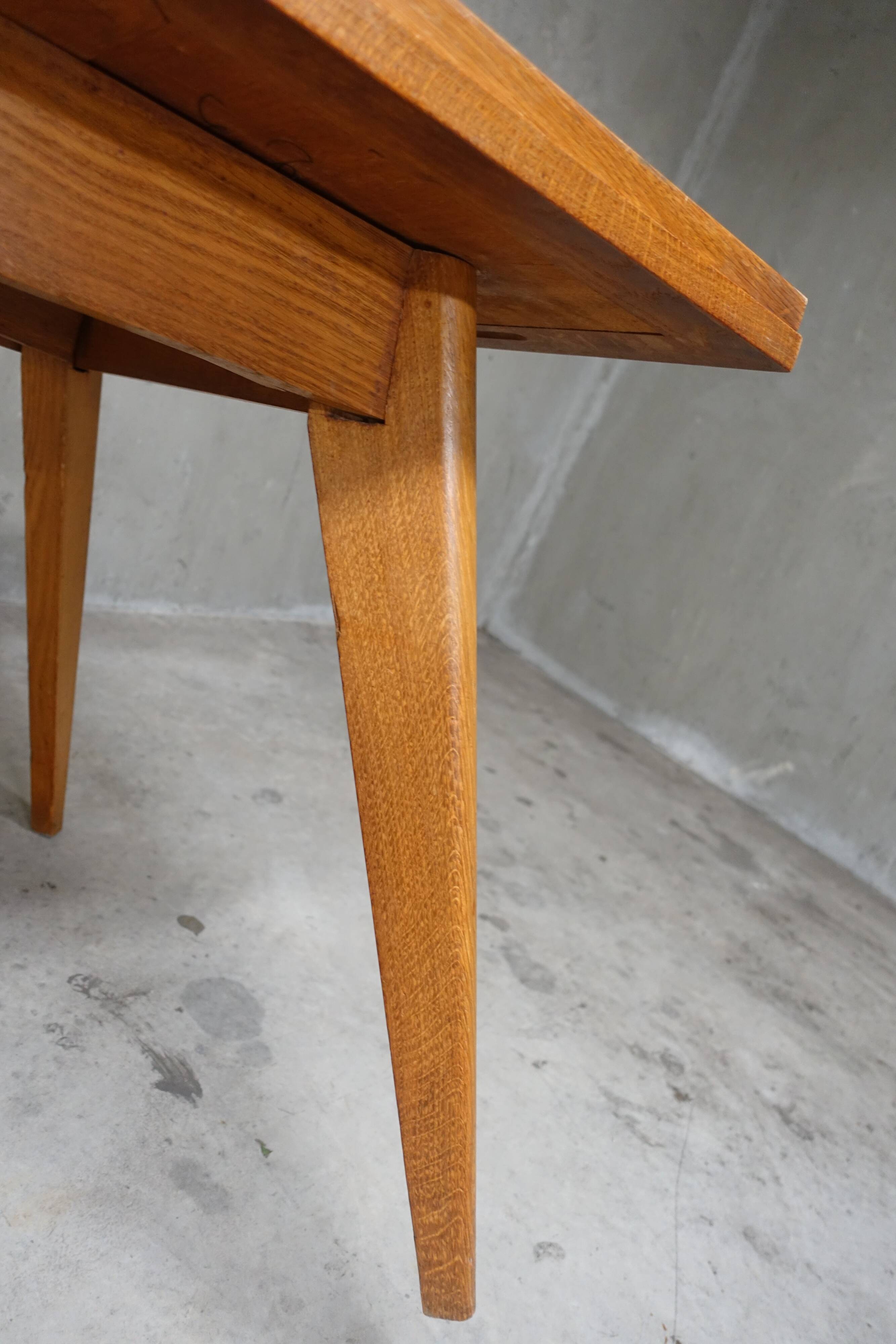 Dining table in blond oak compass feet 1950