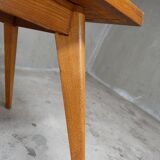 Dining table in blond oak compass feet 1950