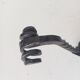 Brutalist wall coat rack in wrought iron.