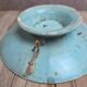 Old small compote dish in turquoise majolica with raised floral decoration.