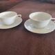 2 large head-to-head coffee cups