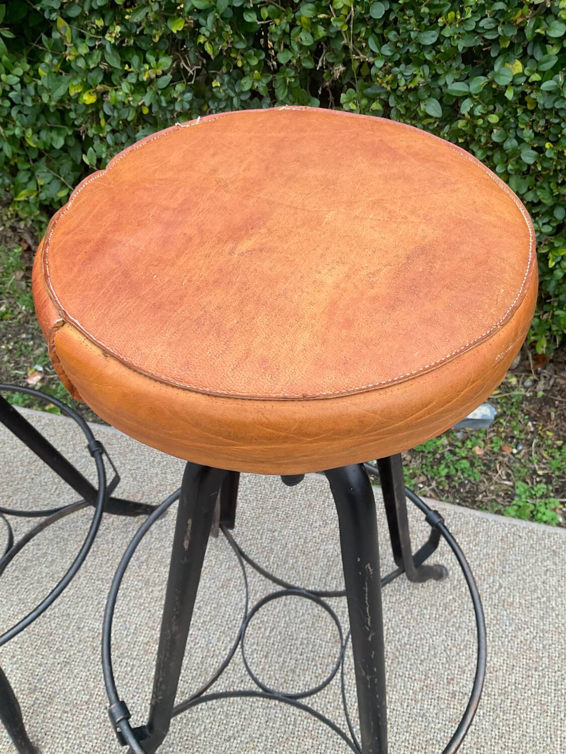Pair of vintage metal and leather bar stools