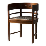 Central European armchair from the early 20th century with an inlaid backrest.