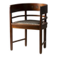Central European armchair from the early 20th century with an inlaid backrest.