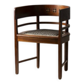 Central European armchair from the early 20th century with an inlaid backrest.