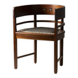Central European armchair from the early 20th century with an inlaid backrest.