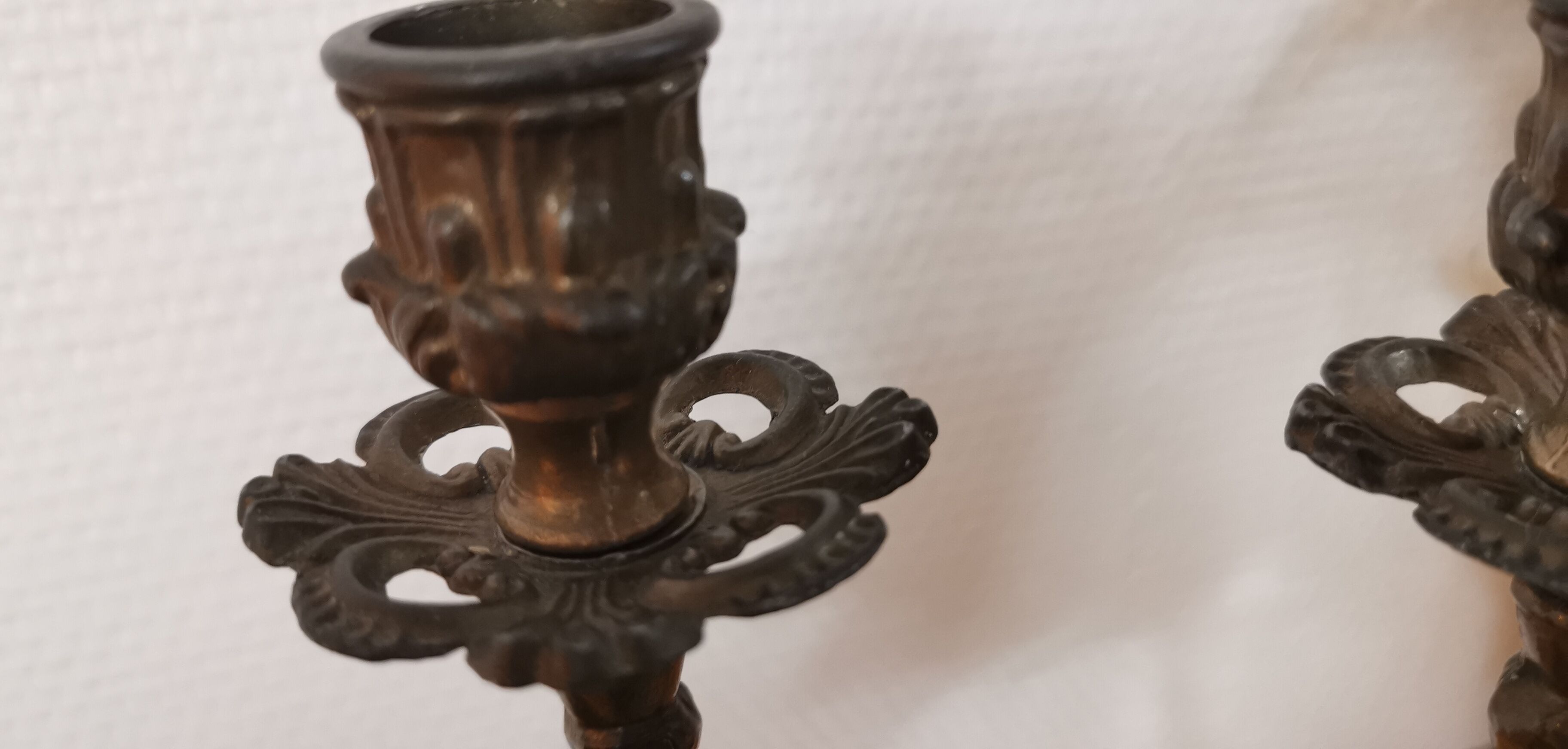 Pair of antique candlesticks in bronze and brass