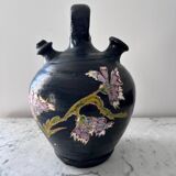 Black water jug with floral decoration