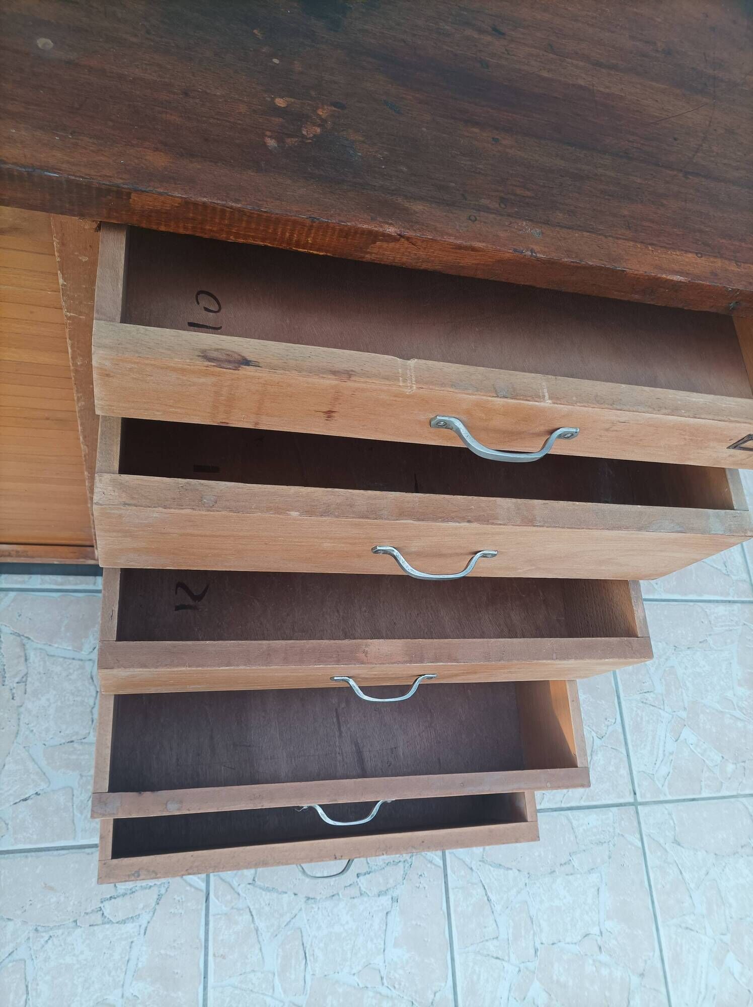 Workshop furniture with drawers and curtain in beech and walnut.