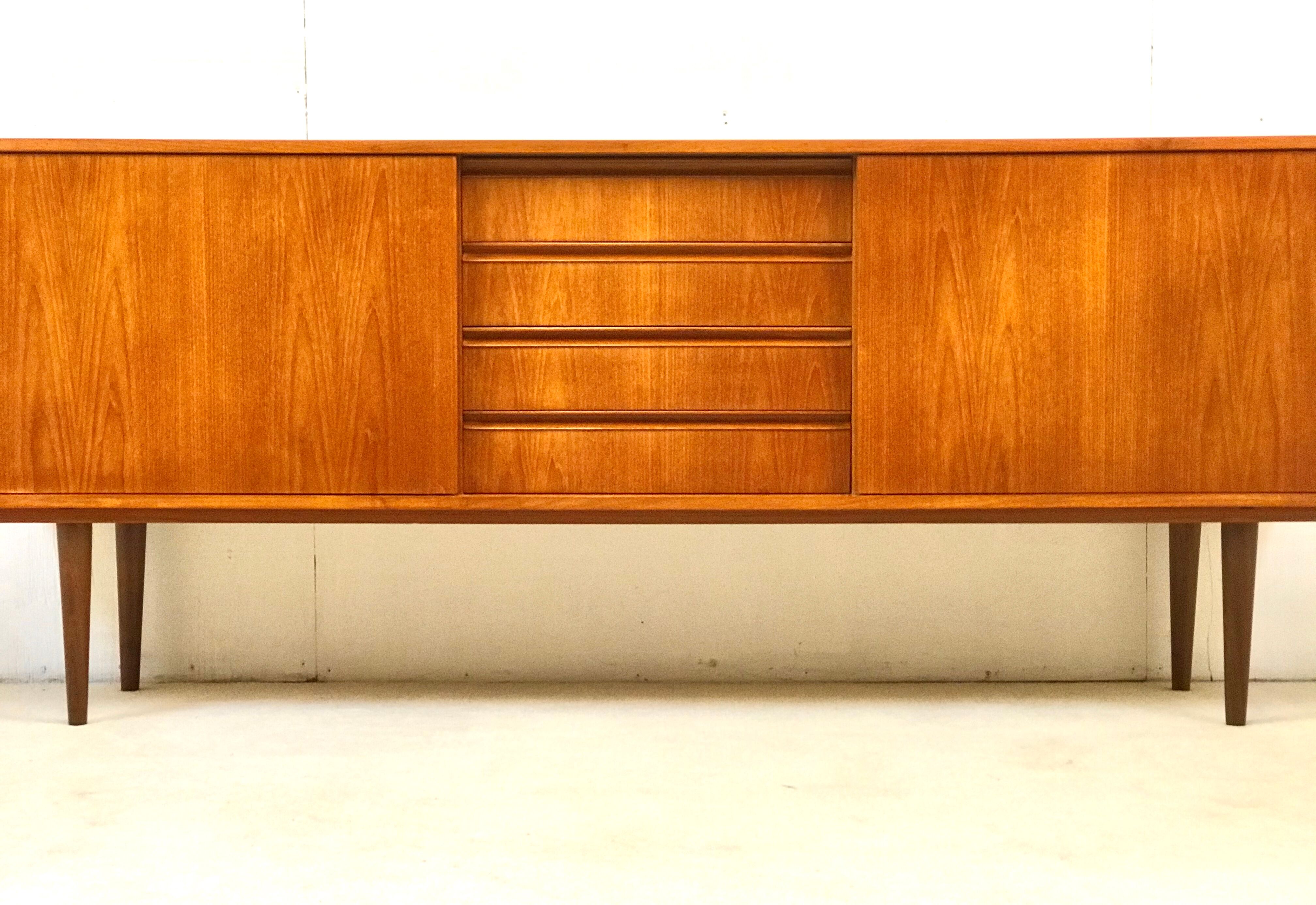 Danish teak sideboard with two sliding doors and 4 central drawers