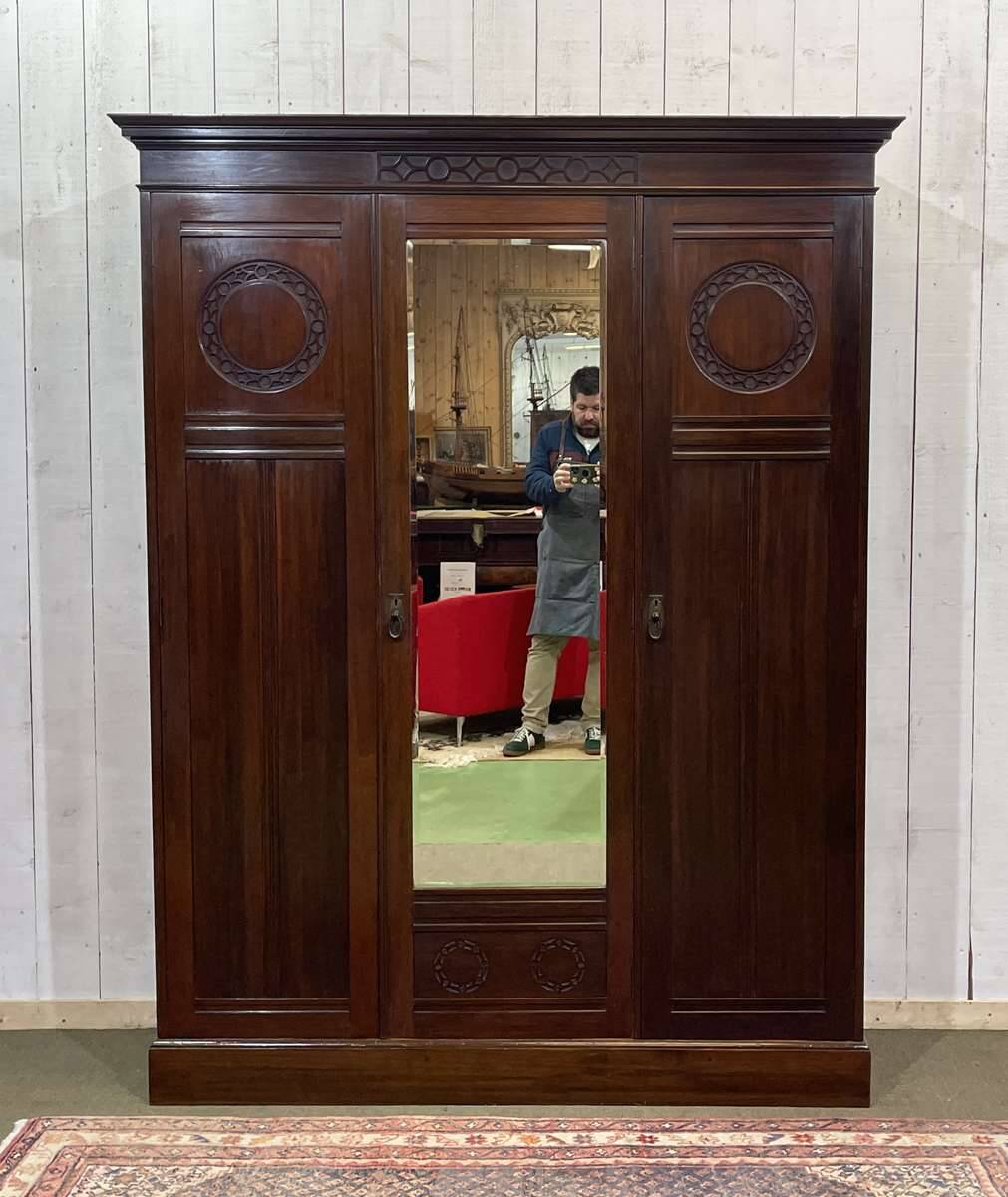 19th-century English mahogany three-door wardrobe.