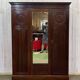 19th-century English mahogany three-door wardrobe.