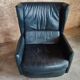 Club armchair in leather by the brand Roset.