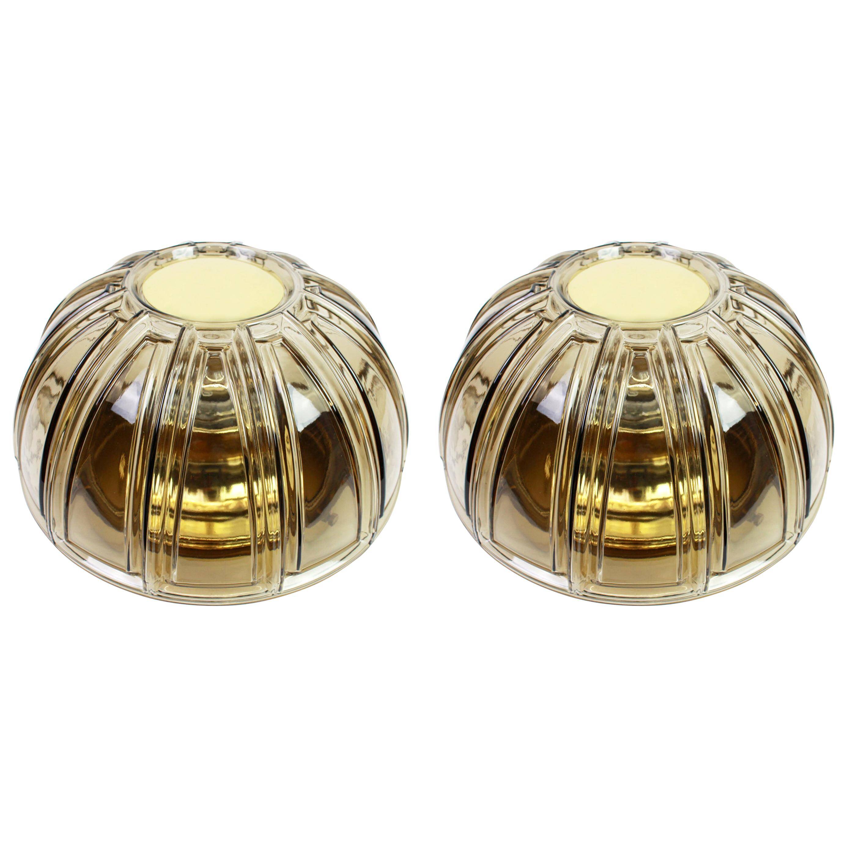 Pair of wall lights or ceiling lights in brass and amber glass by Limburg, Germany, 1960s.