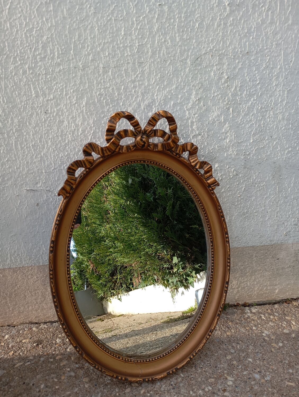 Vintage Louis XVI style oval gold mirror / bow